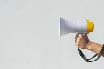 hand holding megaphone protest. High quality beautiful photo concept